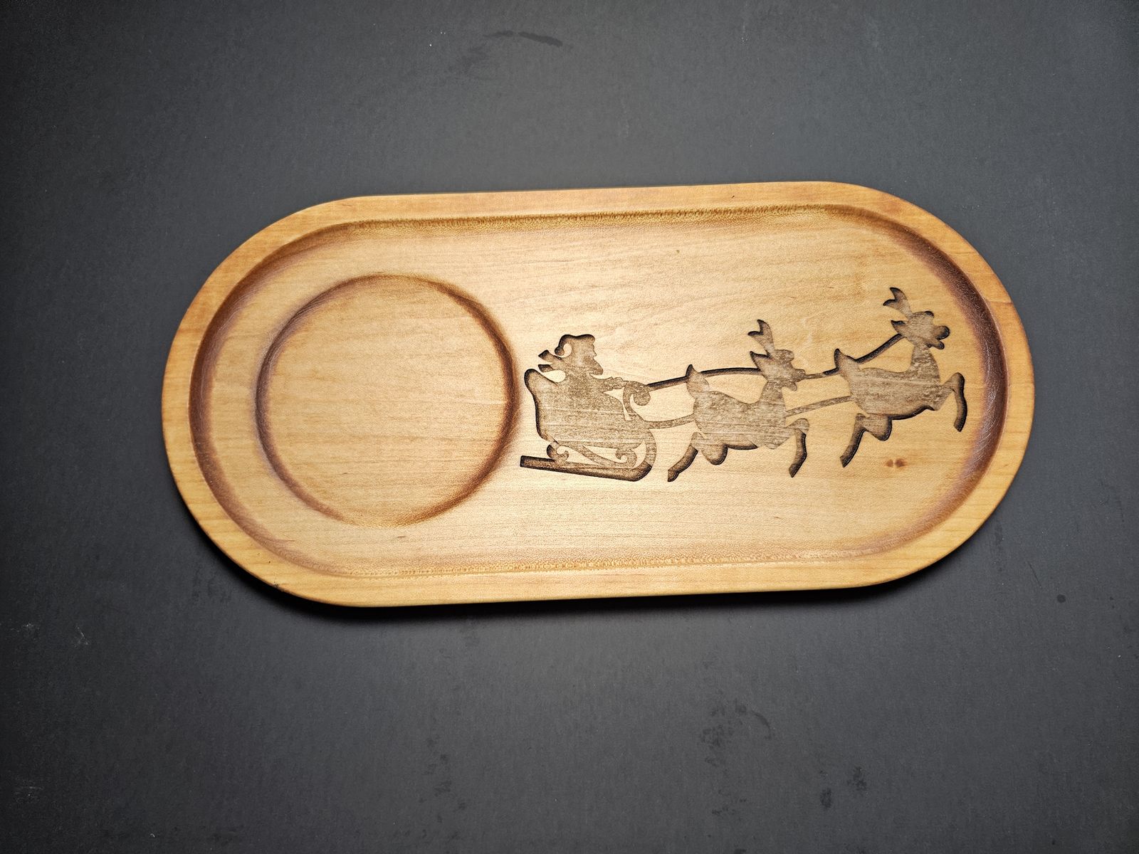 Wooden Santa tray engraved with Santa's sleigh and reindeer, with a ring for a milk glass