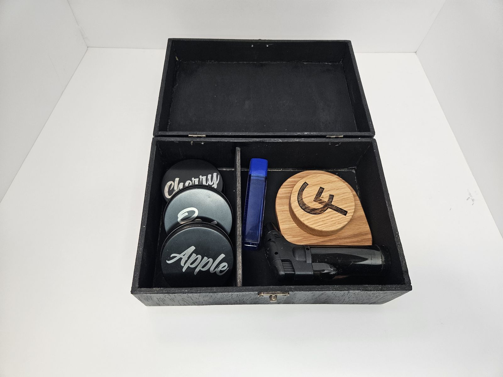 Whiskey smoker kit in its wooden box with flavor tins and torch